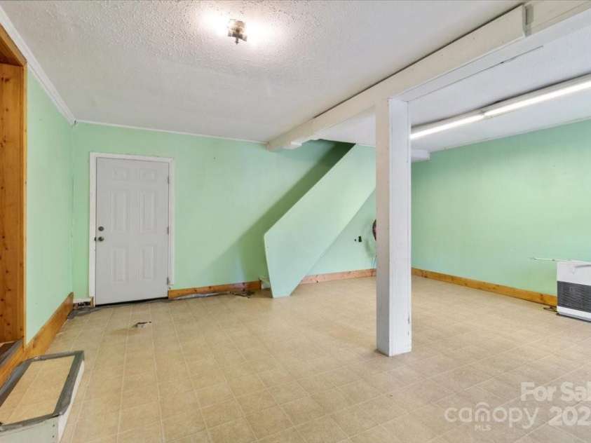 461 Tweed Road, Madison, NC 28753.  MLS# CAR4267871, YatesRealty ID 5652. Stairs before paint and flooring 