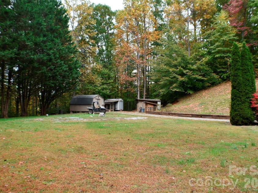177 Natural Trail, Sylva, NC 28779.  MLS# CAR4434524, YatesRealty ID 56632. Large yard with 3 utility building and shed