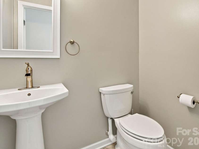 1270 Berra Place, Hickory, NC 28602.  MLS# CAR4433437, YatesRealty ID 56636. Lower level half bathroom