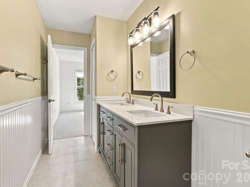 1270 Berra Place, Hickory, NC 28602.  MLS# CAR4433437, YatesRealty ID 56636. Lower level primary bathroom