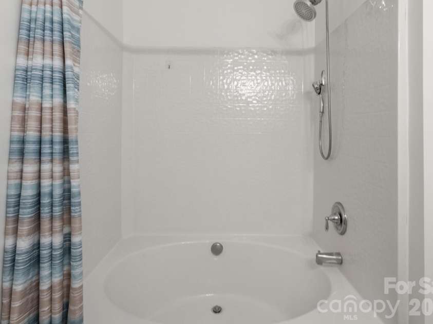 701 Shellstone Place, Fort Mill, SC 29708.  MLS# CAR4434041, YatesRealty ID 56645. Downstairs primary bathroom_2