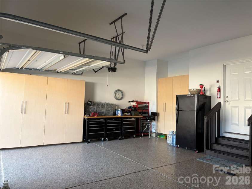 1567 Tranquility Boulevard, Lancaster, SC 29720.  MLS# CAR4433825, YatesRealty ID 56650. 3-car garage with epoxy floors and storage cabinets