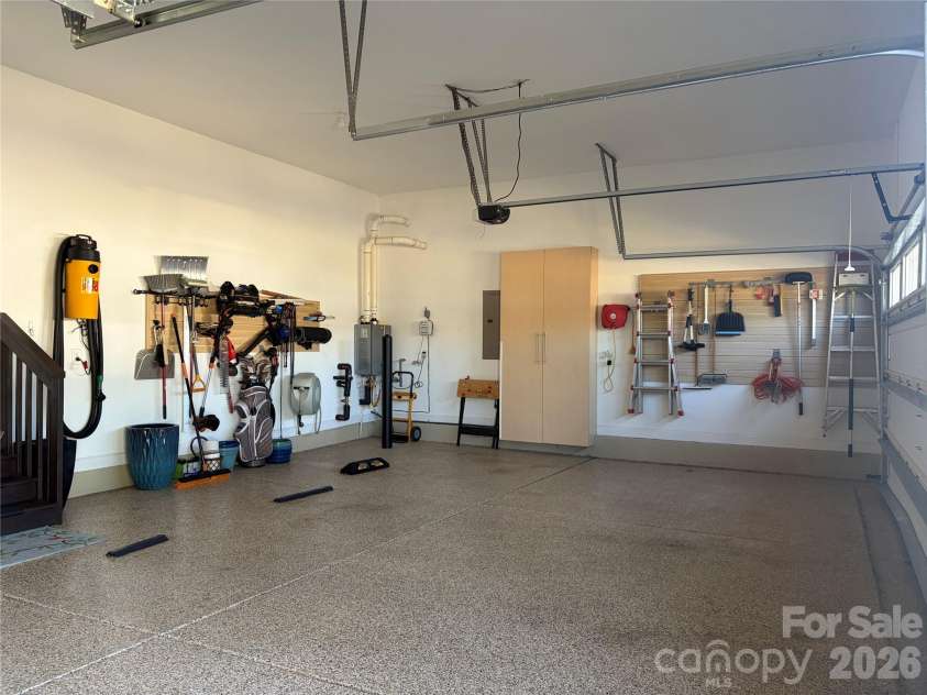 1567 Tranquility Boulevard, Lancaster, SC 29720.  MLS# CAR4433825, YatesRealty ID 56650. 3-car garage with epoxy floors and storage cabinets
