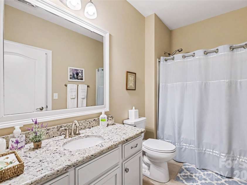 1567 Tranquility Boulevard, Lancaster, SC 29720.  MLS# CAR4433825, YatesRealty ID 56650. Bathroom opens to bedroom 2 and has additional door to hallway