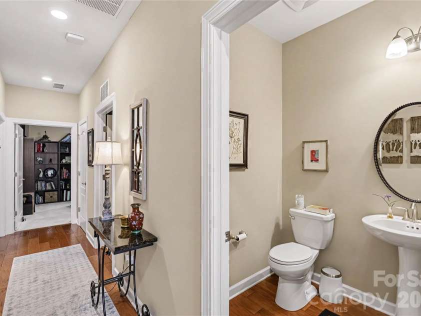 1567 Tranquility Boulevard, Lancaster, SC 29720.  MLS# CAR4433825, YatesRealty ID 56650. Hallway to bedrooms 2 & 3, a second full bathroom, a powder room, and a laundry room