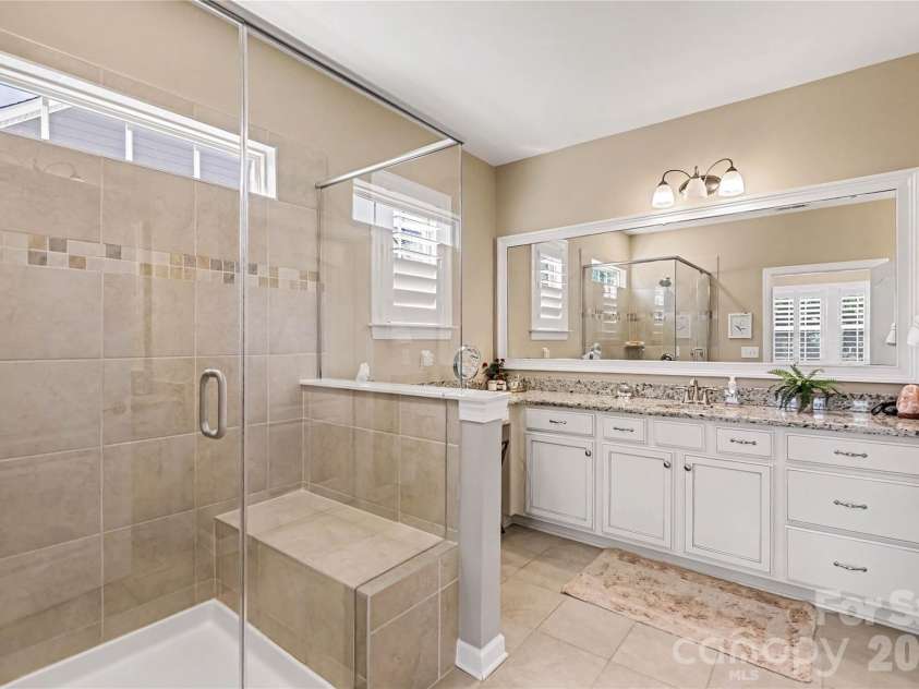 1567 Tranquility Boulevard, Lancaster, SC 29720.  MLS# CAR4433825, YatesRealty ID 56650. Primary bathroom has a large shower, separate vanities, and a private water closet.