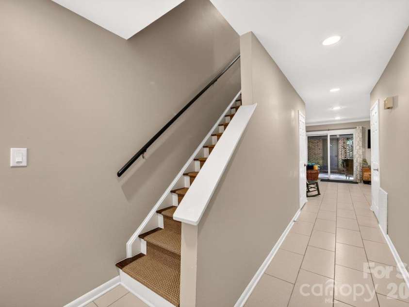 5807 Sharon Road, Charlotte, NC 28210.  MLS# CAR4434151, YatesRealty ID 56666. Lower level landing