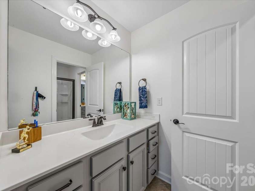 1219 Arges River Drive, Fort Mill, SC 29715.  MLS# CAR4432365, YatesRealty ID 56676. Bathroom connecting Bedrooms Three and Four