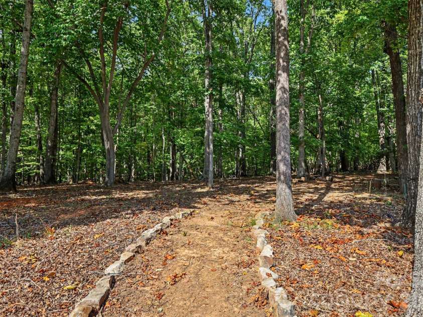 726 Kathy Dianne Drive, Fort Mill, SC 29707.  MLS# CAR4430162, YatesRealty ID 56699. Private back yard surrounded by woods