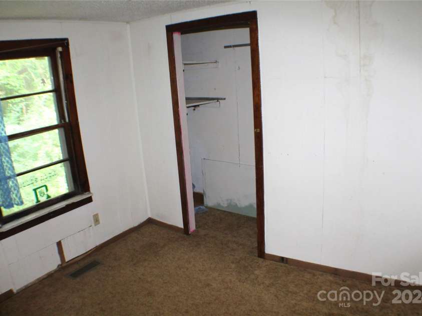 215 Merchant Street, Asheville, NC 28803.  MLS# CAR4165656, YatesRealty ID 567. Hallway between bedrooms