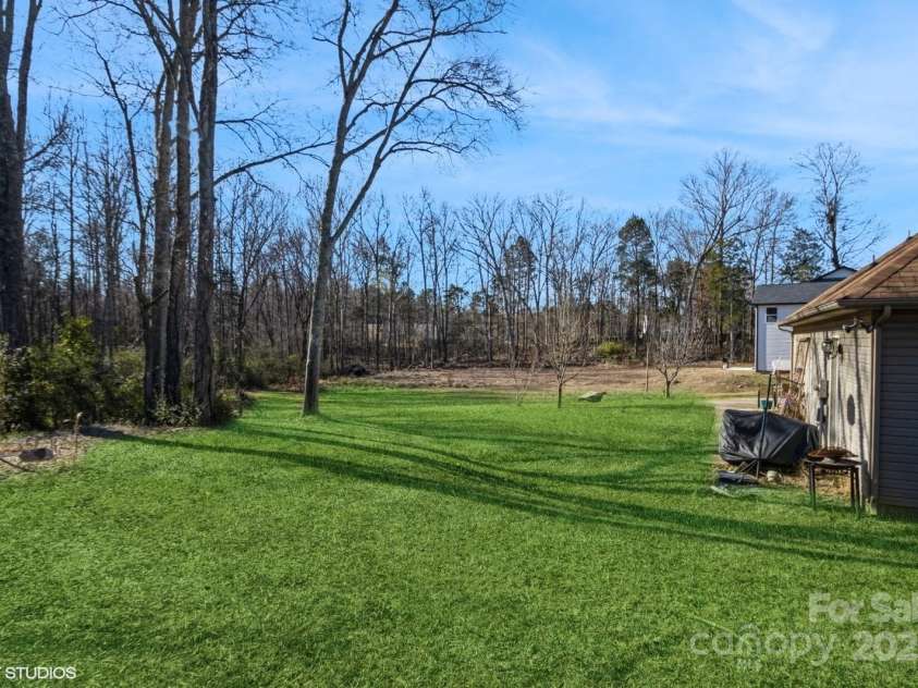 1808 Wilton Gate Drive, Charlotte, NC 28262.  MLS# CAR4203394, YatesRealty ID 5670. Side yard