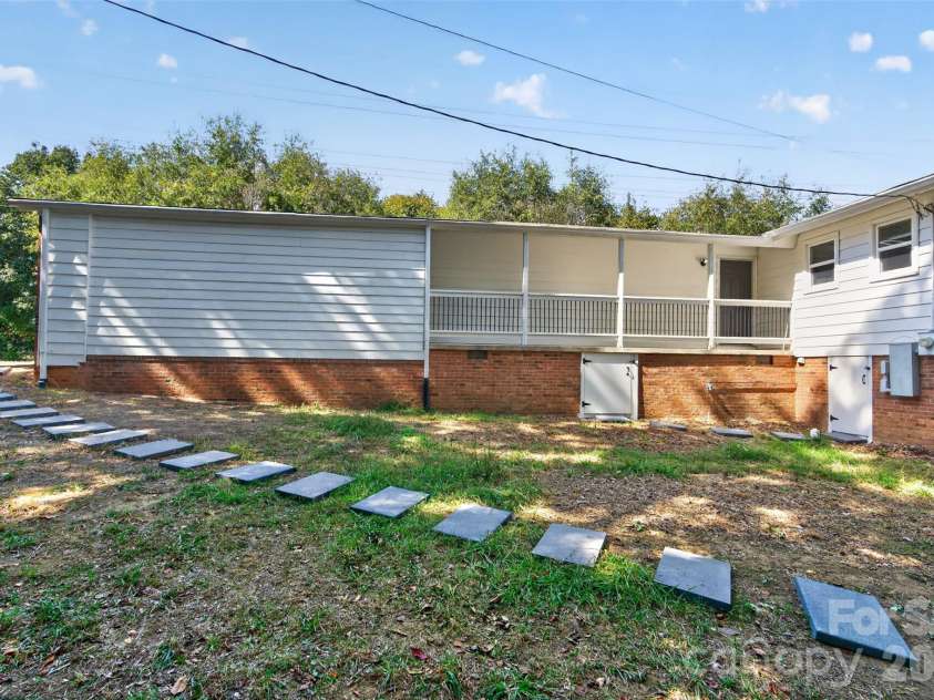 4501 Flowes Store Road, Concord, NC 28025.  MLS# CAR4429896, YatesRealty ID 56705. Backyard and Walkway
