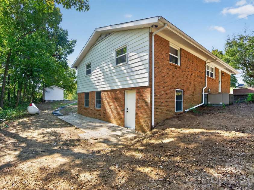 4501 Flowes Store Road, Concord, NC 28025.  MLS# CAR4429896, YatesRealty ID 56705. Backyard Small Patio