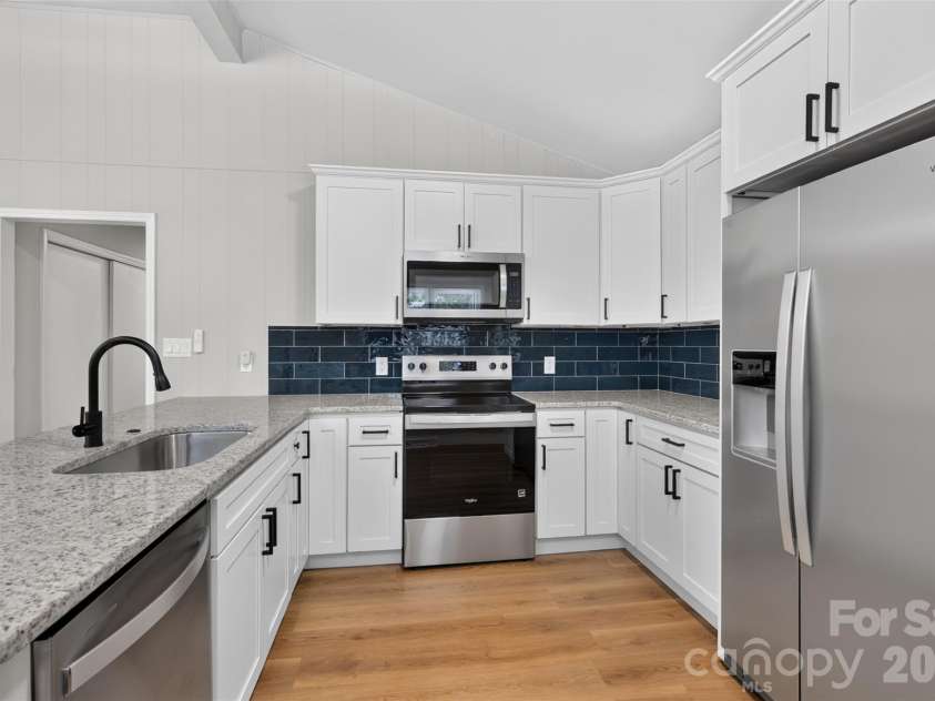 4501 Flowes Store Road, Concord, NC 28025.  MLS# CAR4429896, YatesRealty ID 56705. Kitchen sideview