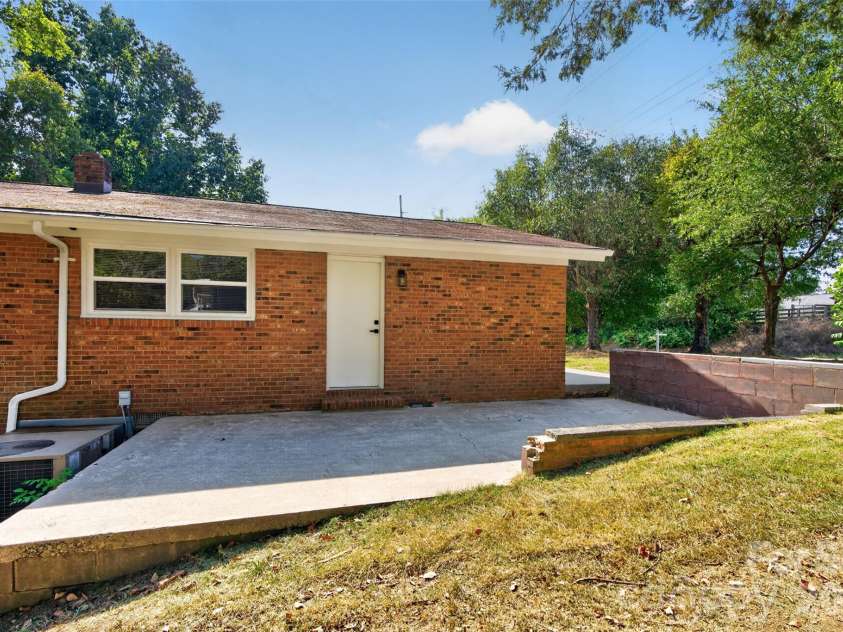 4501 Flowes Store Road, Concord, NC 28025.  MLS# CAR4429896, YatesRealty ID 56705. Side patio