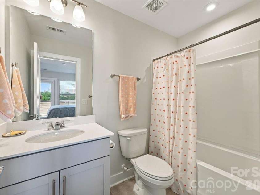 12107 Brooklyn Avenue, Charlotte, NC 28204.  MLS# CAR4434889, YatesRealty ID 56717. Top Floor Bathroom