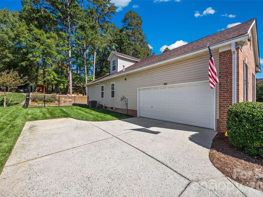 1718 Sanridge Wind Lane, Charlotte, NC 28262.  MLS# CAR4434366, YatesRealty ID 56724. Side Load 2 car garage