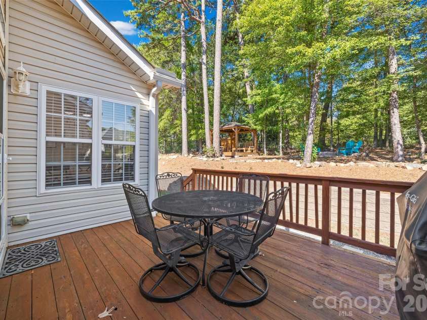 1718 Sanridge Wind Lane, Charlotte, NC 28262.  MLS# CAR4434366, YatesRealty ID 56724. The back yard deck area is the perfect spot for your morning coffee