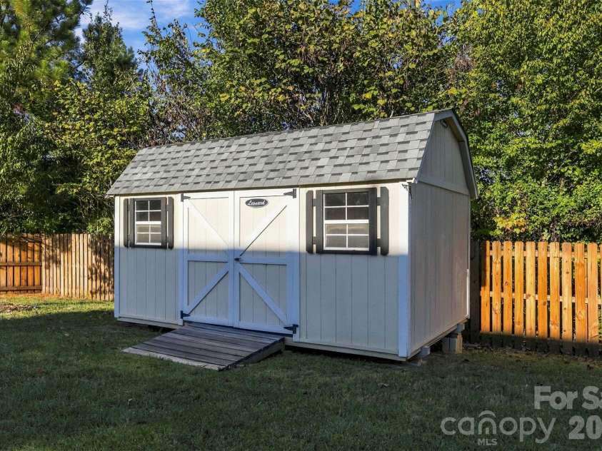 108 Moores Branch Road, Mount Holly, NC 28120.  MLS# CAR4434163, YatesRealty ID 56725. Storage shed in back yard