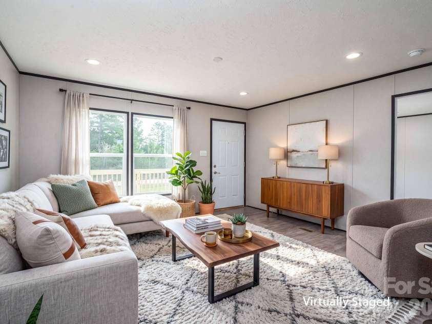 207 Grassy Field Court, Lawndale, NC 28090.  MLS# CAR4433658, YatesRealty ID 56728. Virtually Staged Front Sitting Room that could also be an office