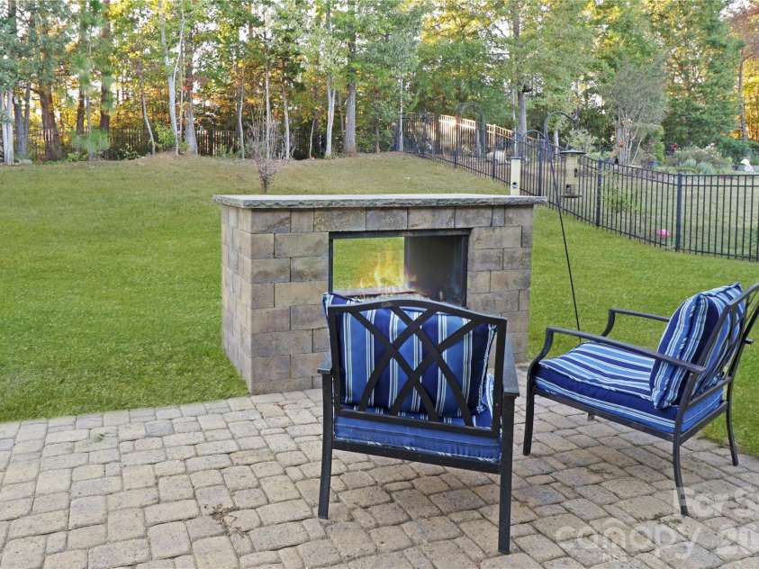 1929 Napa Valley Drive, Waxhaw, NC 28173.  MLS# CAR4434691, YatesRealty ID 56729. Patio Fireplace