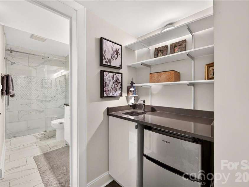 3762 Winding Creek Lane, Charlotte, NC 28226.  MLS# CAR4434831, YatesRealty ID 56737. Lower Level Wet Bar with Beverage Refrigerator