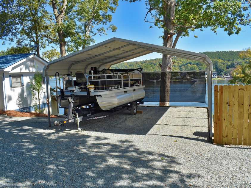 1026 Pinehaven Drive, Badin Lake, NC 28127.  MLS# CAR4434497, YatesRealty ID 56741. Carport.