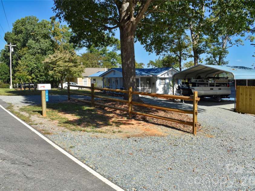 1026 Pinehaven Drive, Badin Lake, NC 28127.  MLS# CAR4434497, YatesRealty ID 56741. Circular driveway.