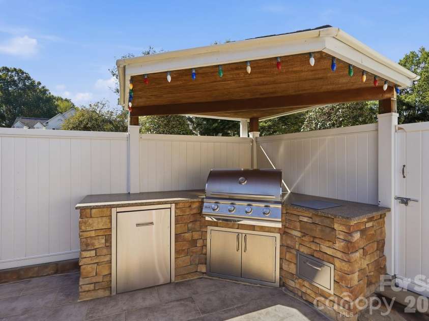 120 Harris Farm Road, Mooresville, NC 28115.  MLS# CAR4430555, YatesRealty ID 56747. Built in outdoor kitchen with overhead protection from the elements while cooking.