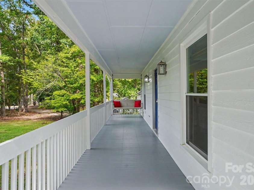 11538 Gelding Drive, Charlotte, NC 28215.  MLS# CAR4422682, YatesRealty ID 56750. Large front porch perfect for enjoying quiet evenings