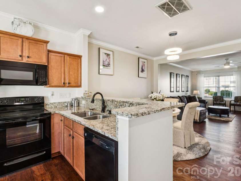 248 Halton Crossing Drive, Concord, NC 28027.  MLS# CAR4434667, YatesRealty ID 56772. Kitchen Open to Dining and Living