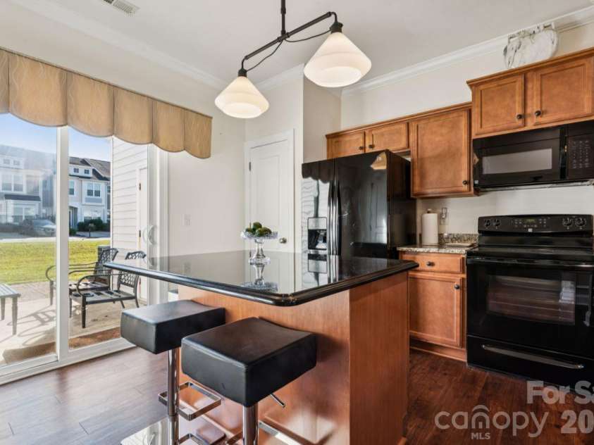 248 Halton Crossing Drive, Concord, NC 28027.  MLS# CAR4434667, YatesRealty ID 56772. Kitchen with Seated Island