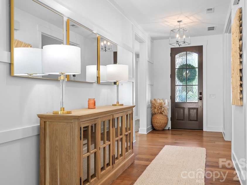 8431 Bassinger Drive, Huntersville, NC 28078.  MLS# CAR4431472, YatesRealty ID 56815. Spacious entryway with a direct view into the beautiful backyard pool area.