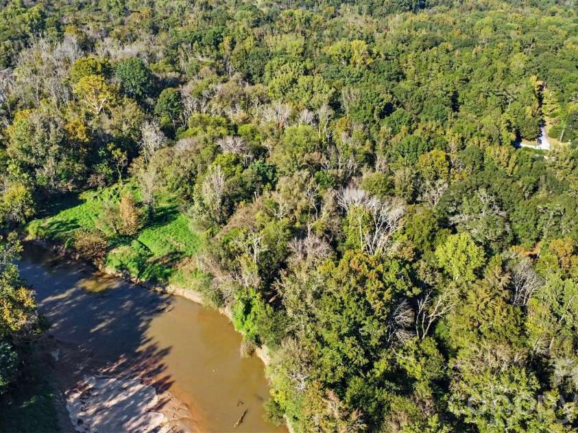 9133 Sunrise Meadow Road, Indian Land, SC 29707.  MLS# CAR4433690, YatesRealty ID 56823. River behind home