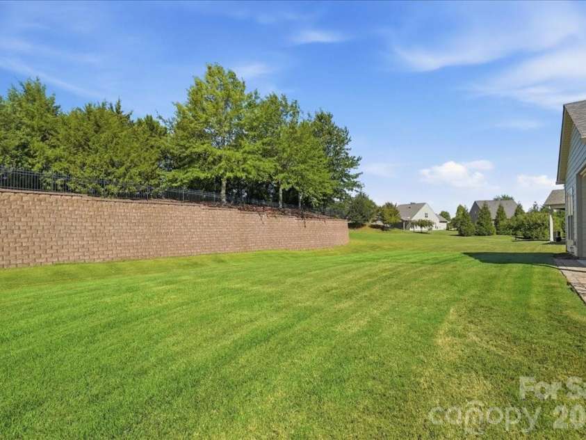 389 Harvest Valley Lane, Fort Mill, SC 29715.  MLS# CAR4428912, YatesRealty ID 56847. Large, flat back yard