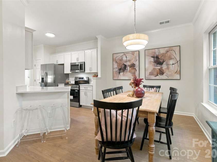18631 Oakhurst Boulevard, Cornelius, NC 28031.  MLS# CAR4435092, YatesRealty ID 56861. Formal dining for larger gatherings and bar top for quick meals!