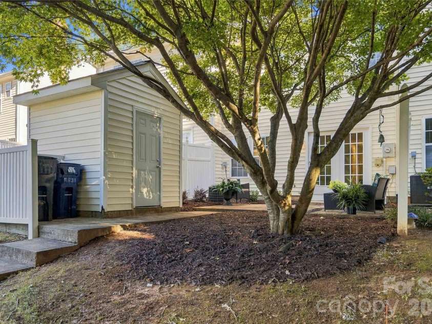18631 Oakhurst Boulevard, Cornelius, NC 28031.  MLS# CAR4435092, YatesRealty ID 56861. Storage and trash can enclosure in rear