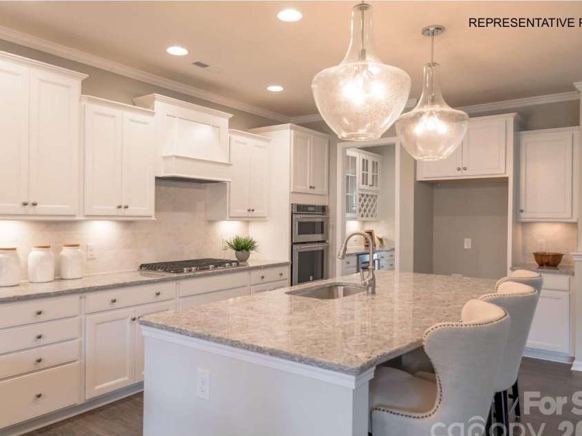 7689 Pedigree Circle, Lancaster, SC 29720.  MLS# CAR4433847, YatesRealty ID 56886. Incredible kitchen with oversized island, ample storage, and designer finishes