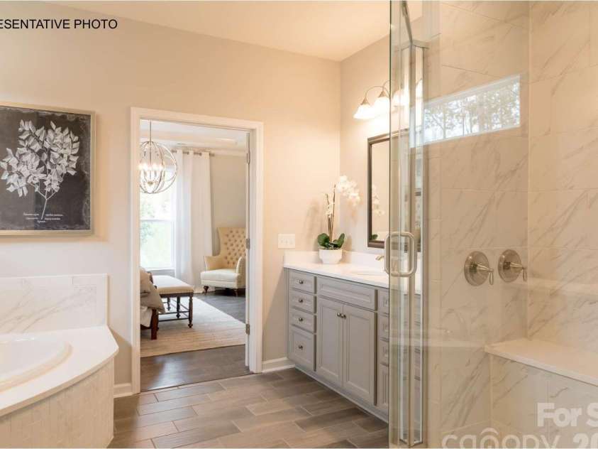 7689 Pedigree Circle, Lancaster, SC 29720.  MLS# CAR4433847, YatesRealty ID 56886. Incredibly-appointed owner's suite bathroom and HUGE walk-in closet!