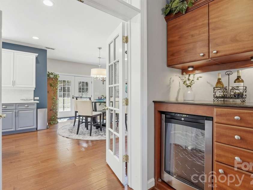 1103 Cooper Lane, Indian Trail, NC 28079.  MLS# CAR4431866, YatesRealty ID 56892. Butler's Bar leading to the Kitchen