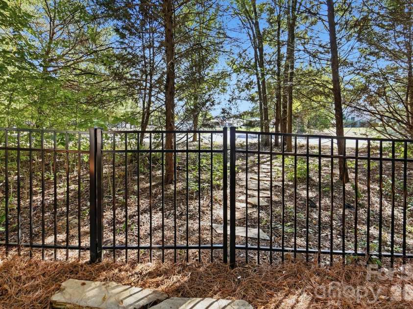 1103 Cooper Lane, Indian Trail, NC 28079.  MLS# CAR4431866, YatesRealty ID 56892. Hidden Backyard Gate leading to Quick Access to the Community Pool & Park