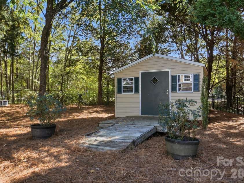 1103 Cooper Lane, Indian Trail, NC 28079.  MLS# CAR4431866, YatesRealty ID 56892. Large Backyard Storage Building