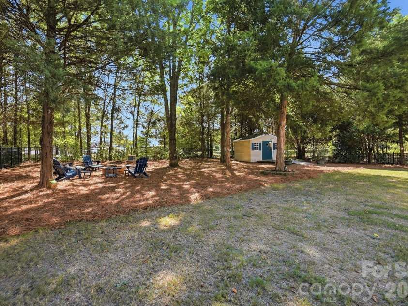 1103 Cooper Lane, Indian Trail, NC 28079.  MLS# CAR4431866, YatesRealty ID 56892. Shaded Backyard Oasis