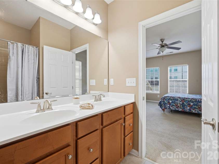 19862 Lamp Lighters Way, Cornelius, NC 28031.  MLS# CAR4430703, YatesRealty ID 56901. Primary Bathroom with double sinks at 19862 Lamp Lighters Way at Antiquity in Cornelius.