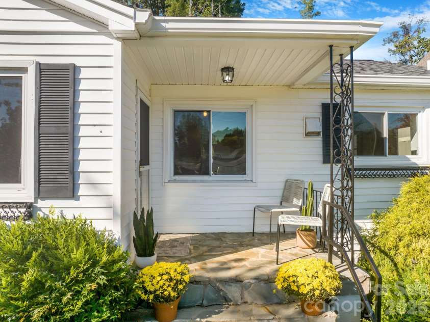 24 Cedar Street, Asheville, NC 28803.  MLS# CAR4422963, YatesRealty ID 56908. Inviting covered front patio.