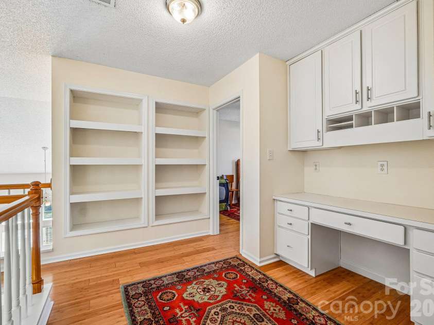 11207 Livingston Mill Road, Charlotte, NC 28273.  MLS# CAR4434862, YatesRealty ID 56926. Loft area on upper level offer built-ins and study area.