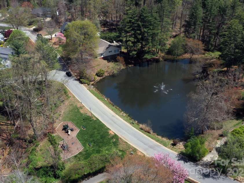 65 Forest Lake Drive, Asheville, NC 28803.  MLS# CAR4245225, YatesRealty ID 5693. Community pond