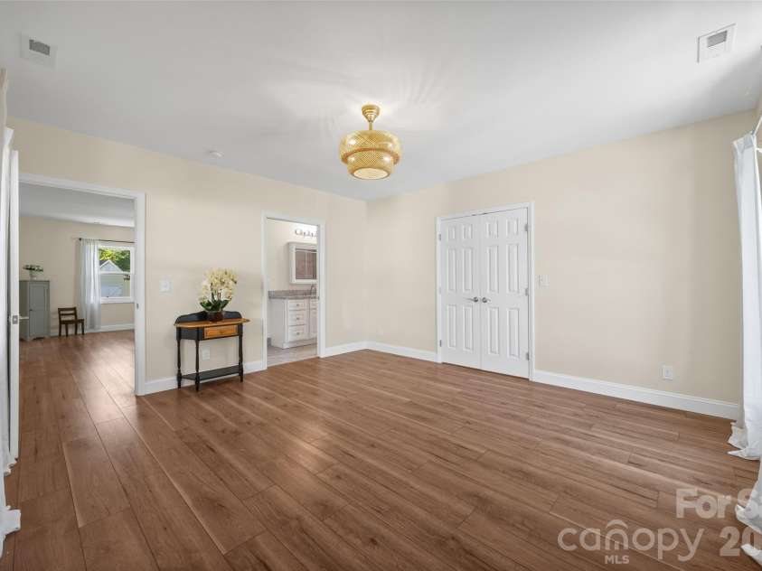 3117 Monte Drive, Monroe, NC 28110.  MLS# CAR4434474, YatesRealty ID 56942. Flex room on office addition has Closet, laundry, storage and an adjacent full bathroom.