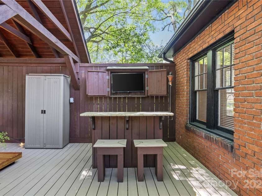 2125 Kenilworth Avenue, Charlotte, NC 28203.  MLS# CAR4244475, YatesRealty ID 5695. Bar area with TV (which remains)
