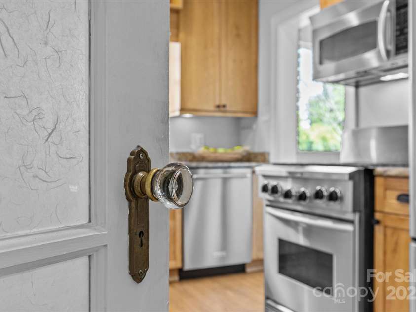 2125 Kenilworth Avenue, Charlotte, NC 28203.  MLS# CAR4244475, YatesRealty ID 5695. Pantry door in kitchen